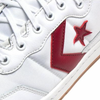 A CONVERSE CONS FASTBREAK PRO WHITE / TEAM RED / GUM sneaker with a star on the side.