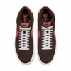A pair of Nike SB Blazer Mid Baroque Brown / Adobe / White sneakers.