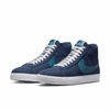 A pair of Nike SB Blazer Mid Midnight Navy / Noise Aqua sneakers on a white background.