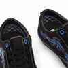 A pair of VANS SKATE BREANA GEERING OLD SKOOL BLUE / BLACK shoes on a white surface.