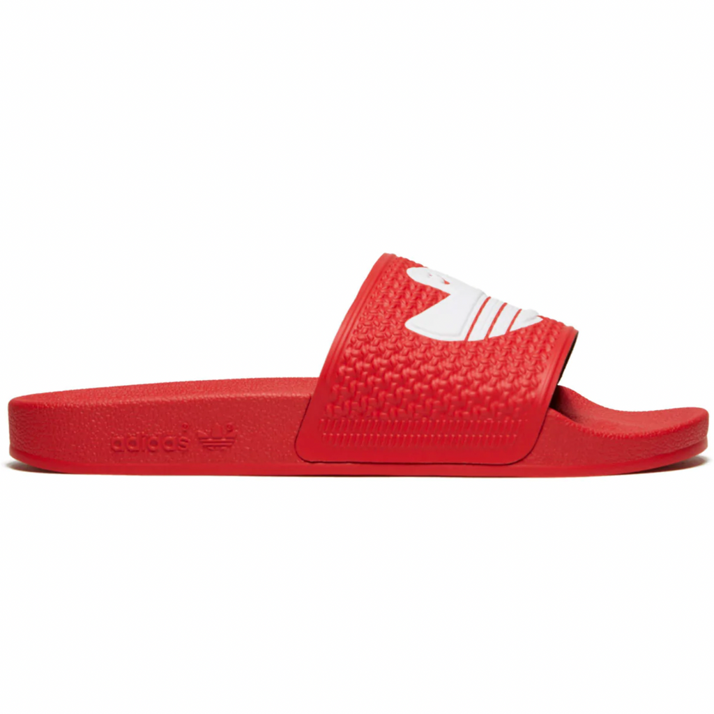 A pair of ADIDAS SHMOOFOIL SCARLET / WHITE slides on a white background.