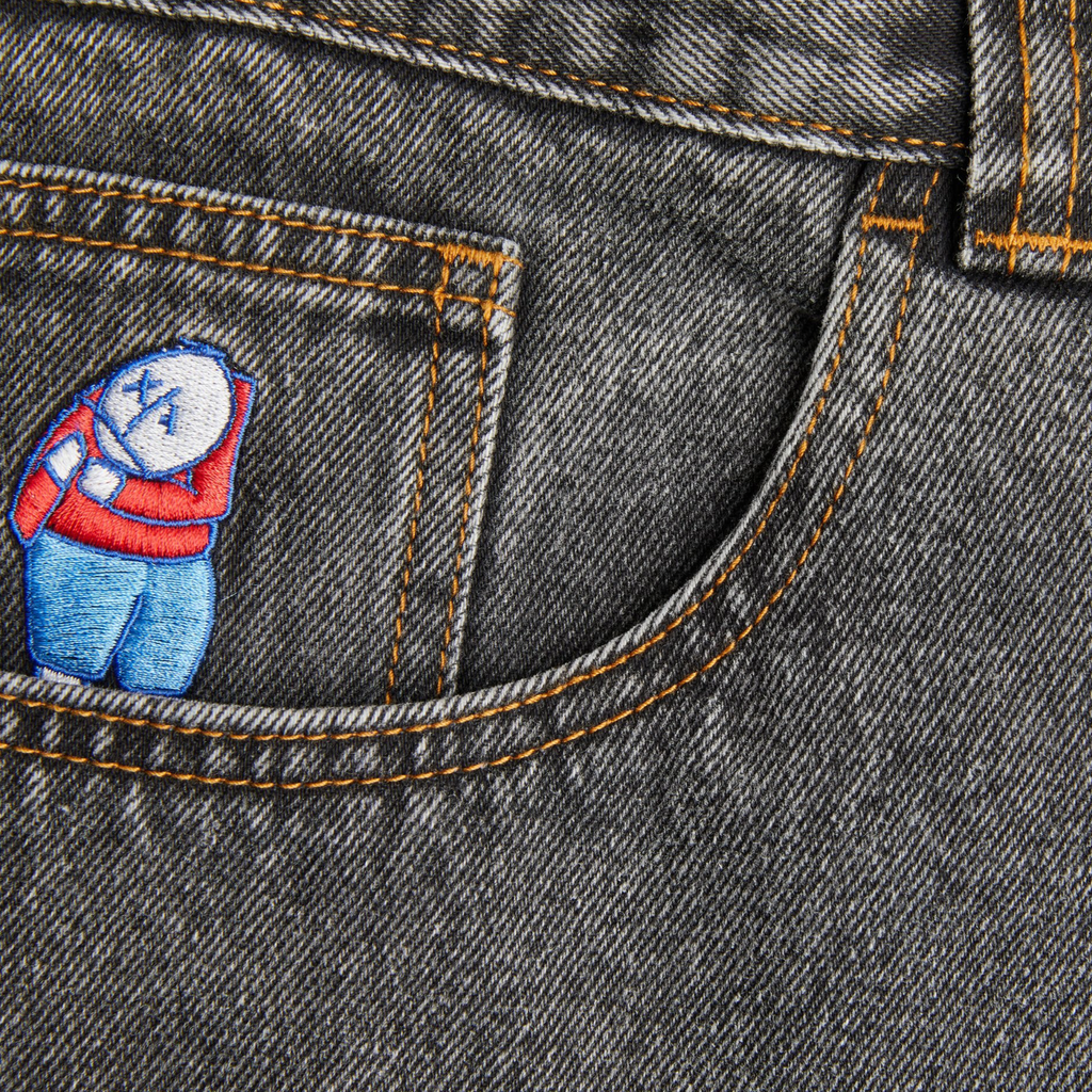 A patch of POLAR BIG BOY WASHED BLACK on the back of a pair of jeans by POLAR.