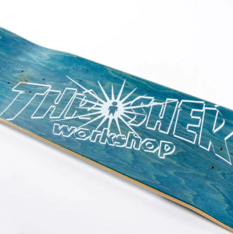 An ALIEN WORKSHOP X THRASHER BELIEVE skateboard with white writing on it.