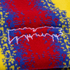 A red, yellow, and blue striped beanie with a FA embroidery on it.