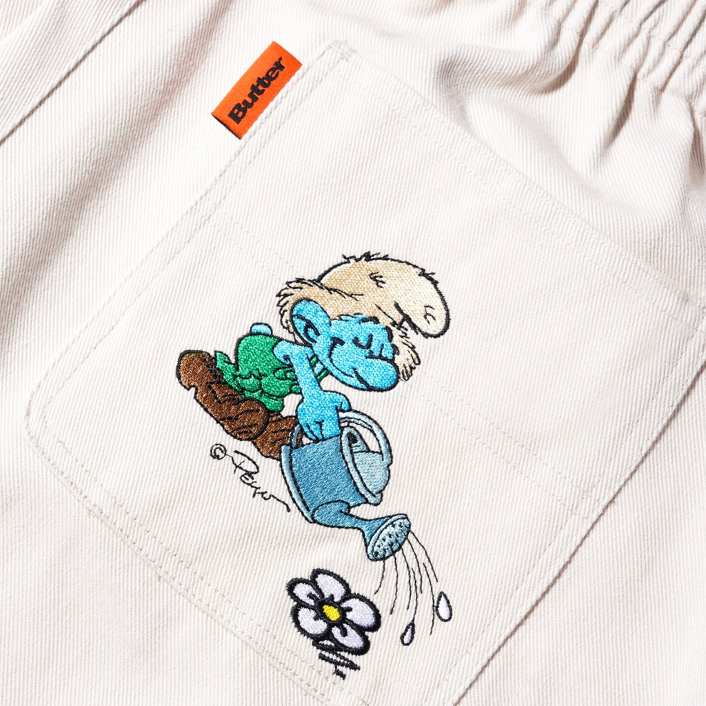 a picture of BUTTER GOODS X THE SMURFS FORAGE WIDE LEG PANT NATURAL on a white shirt by Butter Goods