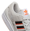 A white and orange ADIDAS FORUM 84 LOW ADV ONE GREY / IMPACT ORANGE sneakers.