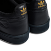 A pair of black and gold ADIDAS X FA EXPERIMENT 2 TRIPLE BLACK sneakers.