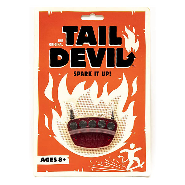 A DOPE WAX TAIL DEVIL RED skateboard accessory in its red packaging, labeled "Spark It Up!" for ages 8 and up. The packaging features an illustration of flames and a figure skating.