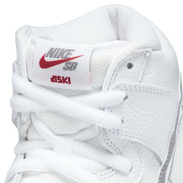 Close-up of the Nike SB Dunk High Pro ISO Oski Shark in White/Cool Grey, featuring a textured leather upper, white mesh tongue with red Nike SB logo and dsk1 branding. Available at Bluetile Skateboards.