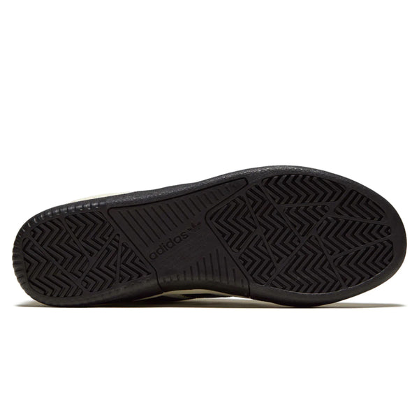The sole of an ADIDAS TYSHAWN CLOUD WHITE / CORE BLACK / PURPLE shoe on a white background.