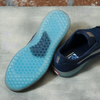 A pair of VANS AVE DRESS BLUE sneakers with blue soles on a concrete floor.