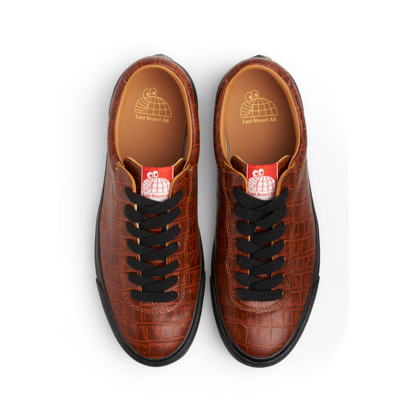 A pair of LAST RESORT AB VM001 CROC BROWN/BLACK shoes from Last Resort AB with black laces.