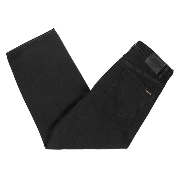 A pair of Volcom Billow Denim Loose Fit Black jeans on a white background.