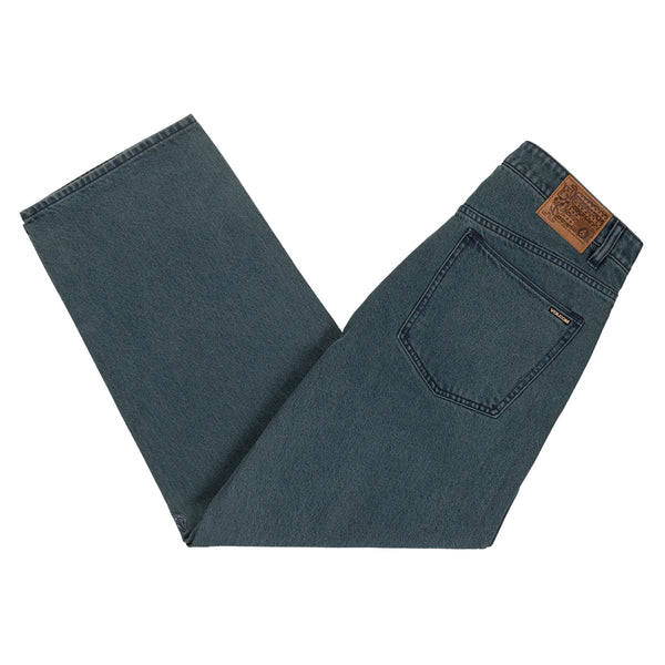 A pair of VOLCOM BILLOW DENIM LOOSE FIT MARINA BLUE jeans with a brown label.