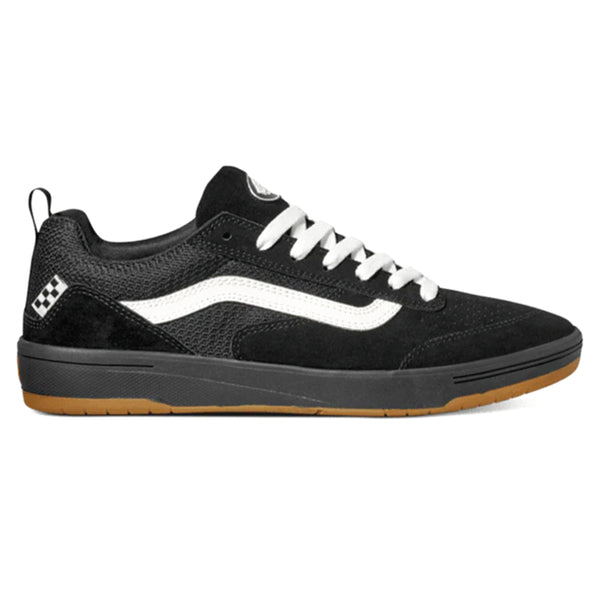 A VANS black and white skateboard shoe with white laces.
