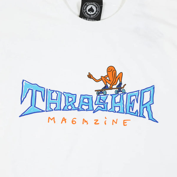 THRASHER GONZ THUMBS UP TEE WHITE by THRASHER features the "Thrasher Magazine" logo in blue and orange, along with an orange cartoon figure skateboarding on the letters, capturing the iconic Gonz style.