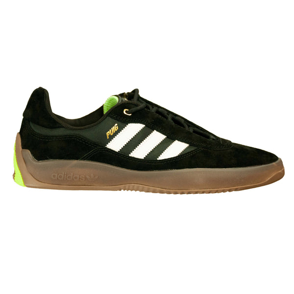 A black and green ADIDAS PUIG CORE BLACK / WHITE / GUM shoe.