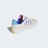 A white and blue ADIDAS PUIG CLOUD WHITE / SONIC INK / SIGNAL CYAN shoe with multi colored stripes.