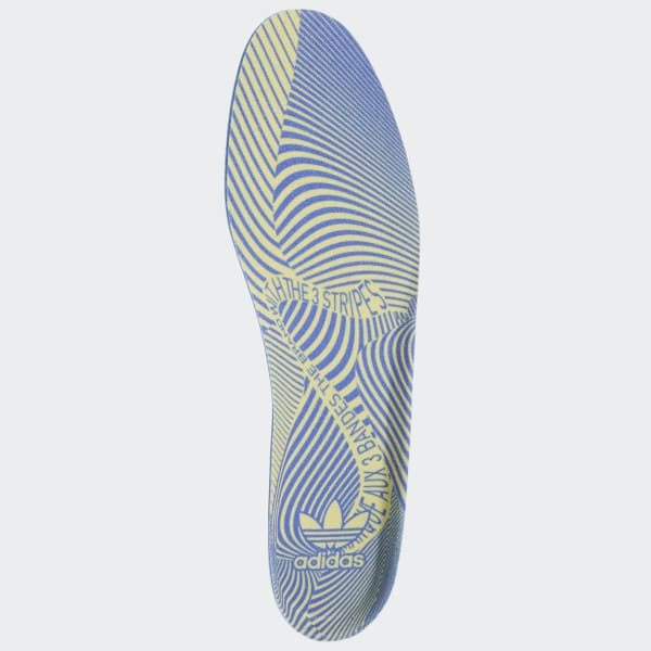 A pair of ADIDAS PUIG CLOUD WHITE / SONIC INK / SIGNAL CYAN insoles on a white background.