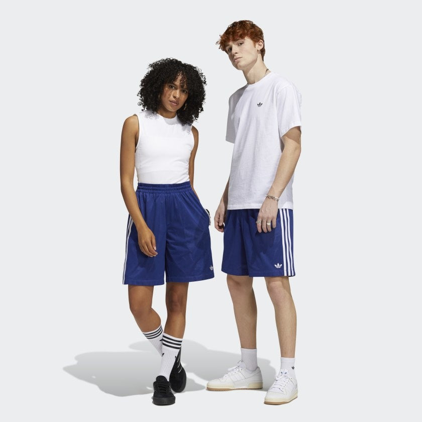 a man and women modeling the adidas basketball shorts with white shirts