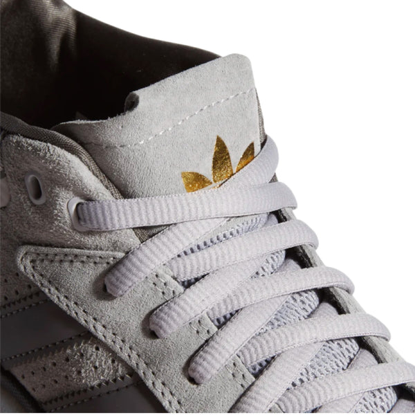A pair of ADIDAS TYSHAWN LIGHT GRANITE / GRANITE adidas sneakers.
