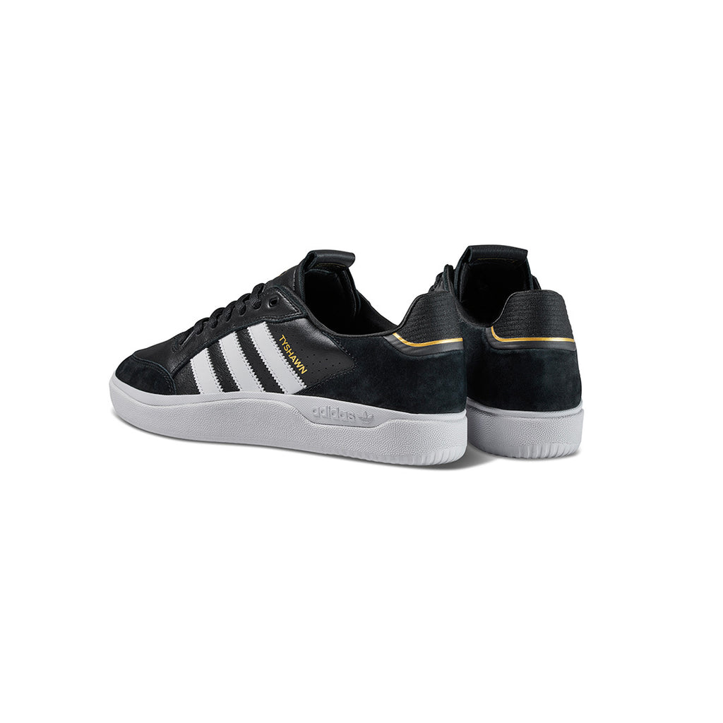 A pair of ADIDAS TYSHAWN LOW BLACK / WHITE sneakers.