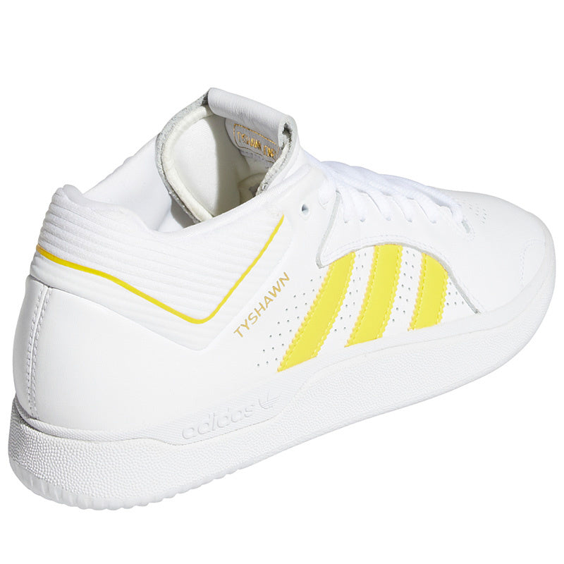 An ADIDAS TYSHAWN FLAT WHITE / YELLOW / GOLD tennis shoe.