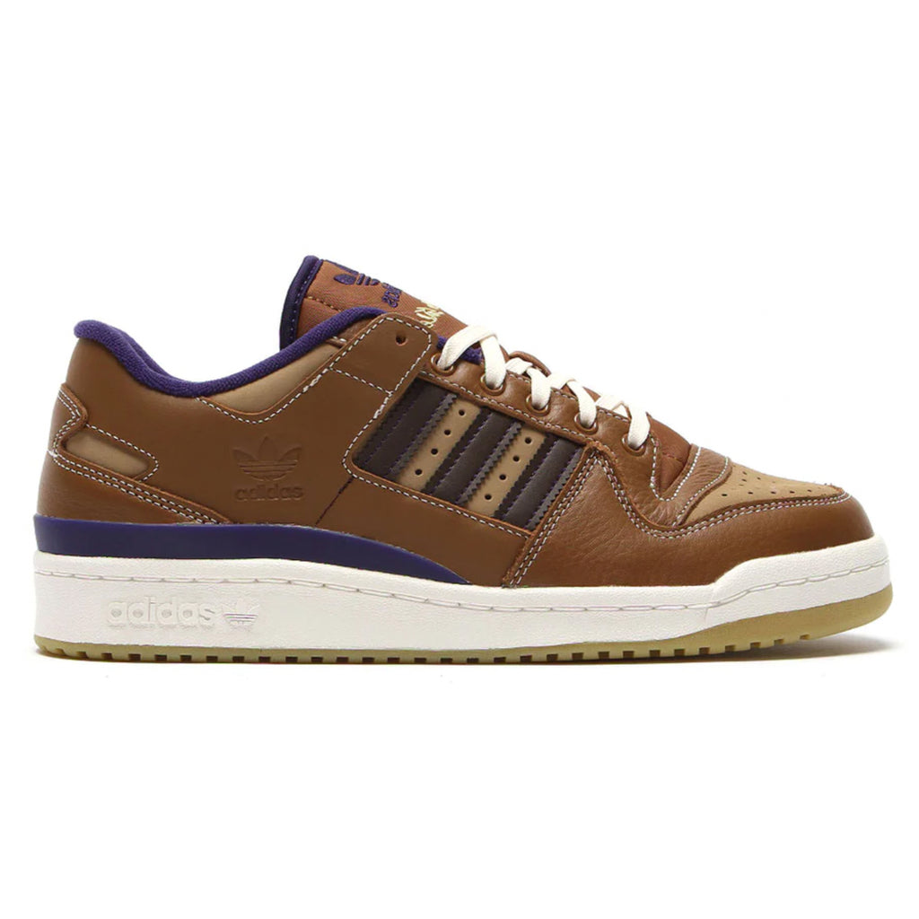 A brown and blue ADIDAS FORUM 84 LOW ADV x HEITOR WILD sneakers.
