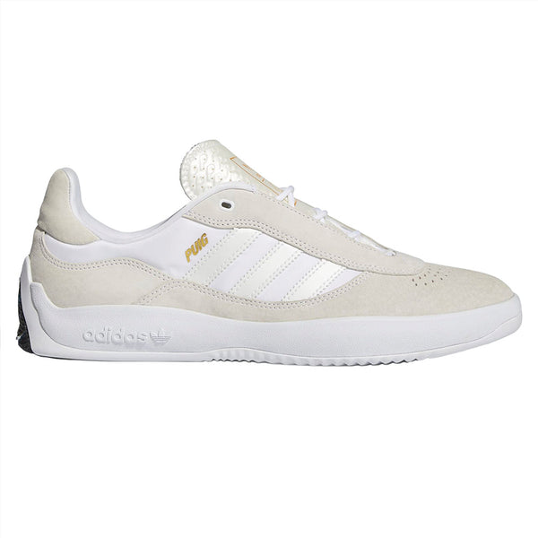 A pair of ADIDAS PUIG CLOUD WHITE / CORE BLACK sneakers with a white sole.