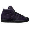 A pair of ADIDAS KADER SYLLA PRO MODEL ADV CORE BLACK / DARK PURPLE sneakers with black soles.