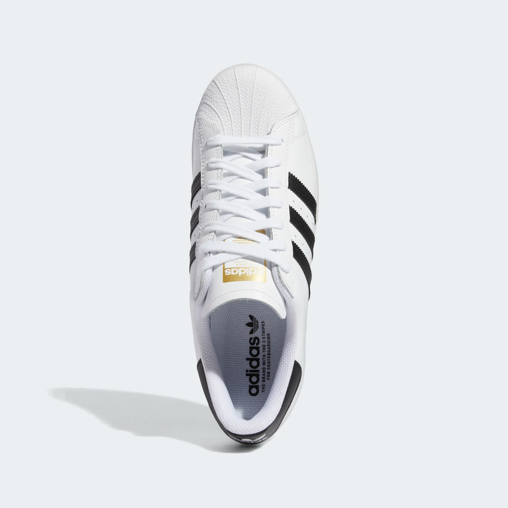 A white and black Adidas Superstar ADV Flat White/Core Black sneakers.