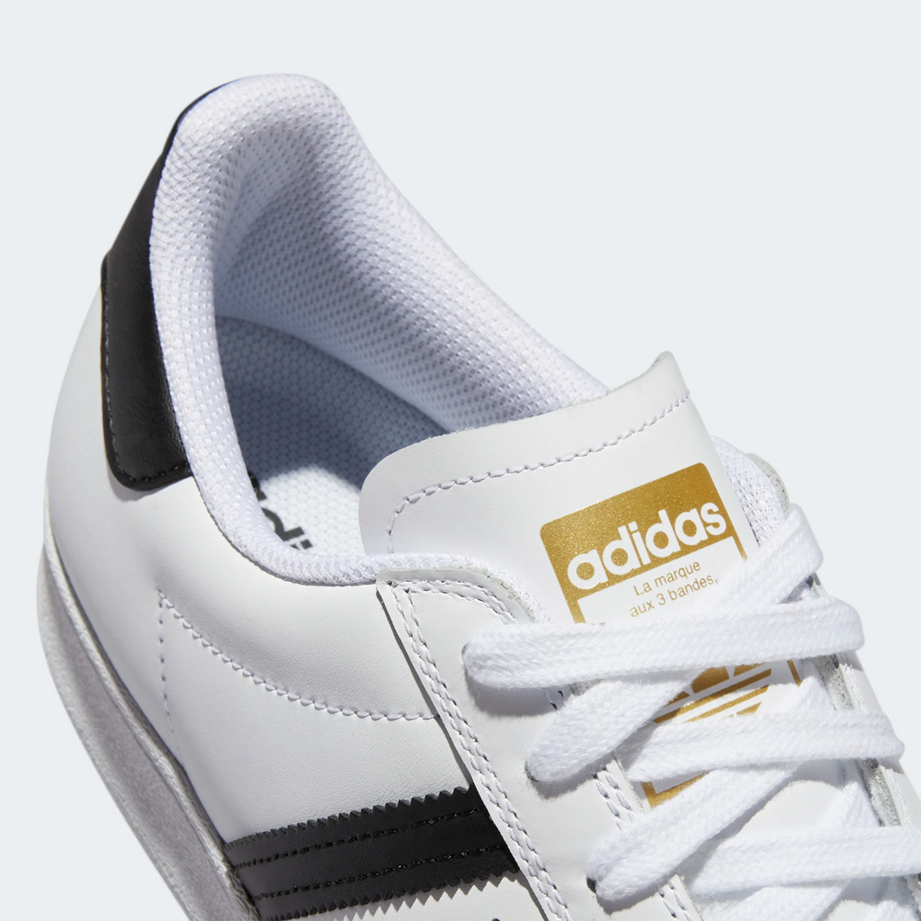 White adidas with gold stripes sales