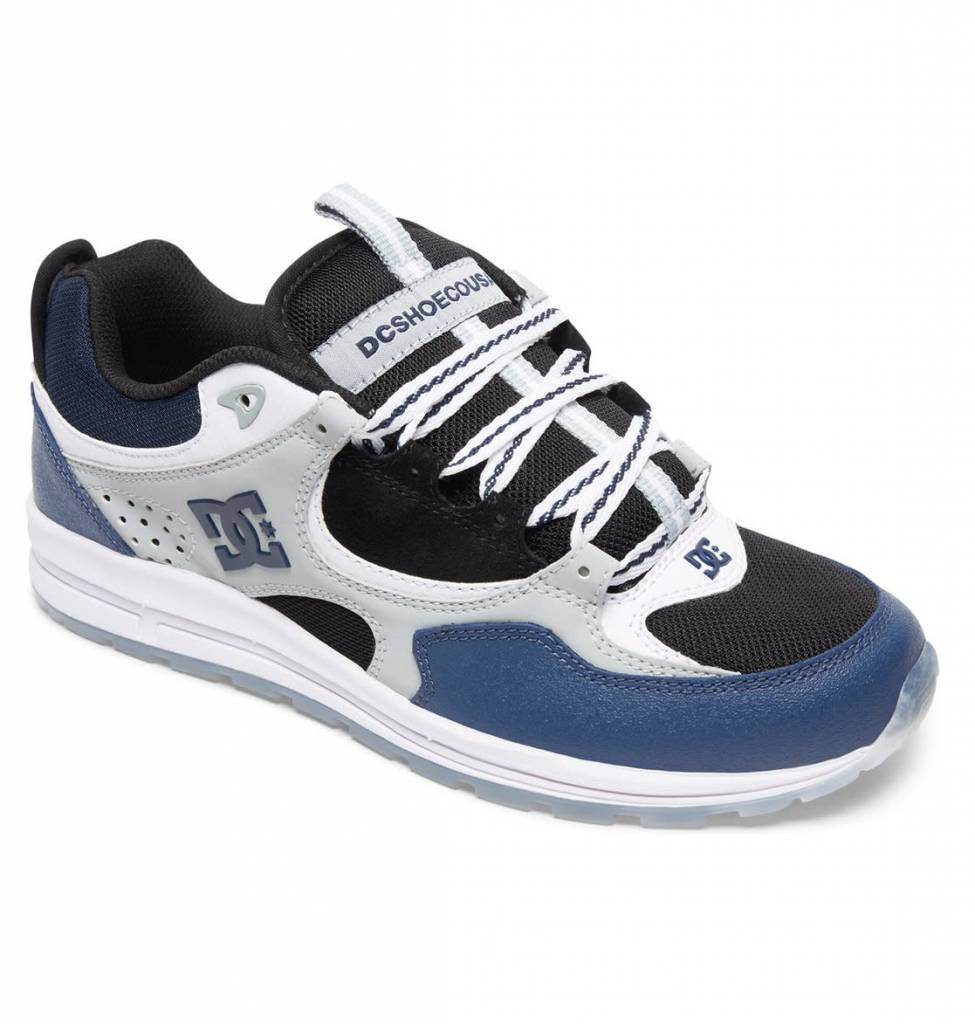 A blue and white DC KALIS LITE SE BLUE / BLACK / GREY skate shoe featuring suede uppers and DC branding.