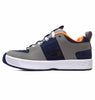A pair of men's grey and orange DC HERITAGE LYNX OG sneakers from the DC heritage line.