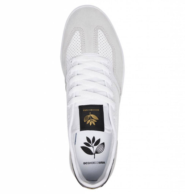 A DC shoe with a gold leaf on it.