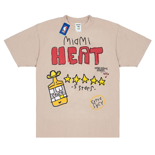 Oatmeal T-shirt featuring a design with "Miami Heat," five stars, a hot sauce bottle, and the text "Extra Spicy." This AFTER SCHOOL SPECIAL X SHAKA WEAR X NBA HEAT TEE is crafted from a Premium Heavyweight Garment Dyed Tee for ultimate comfort and durability.