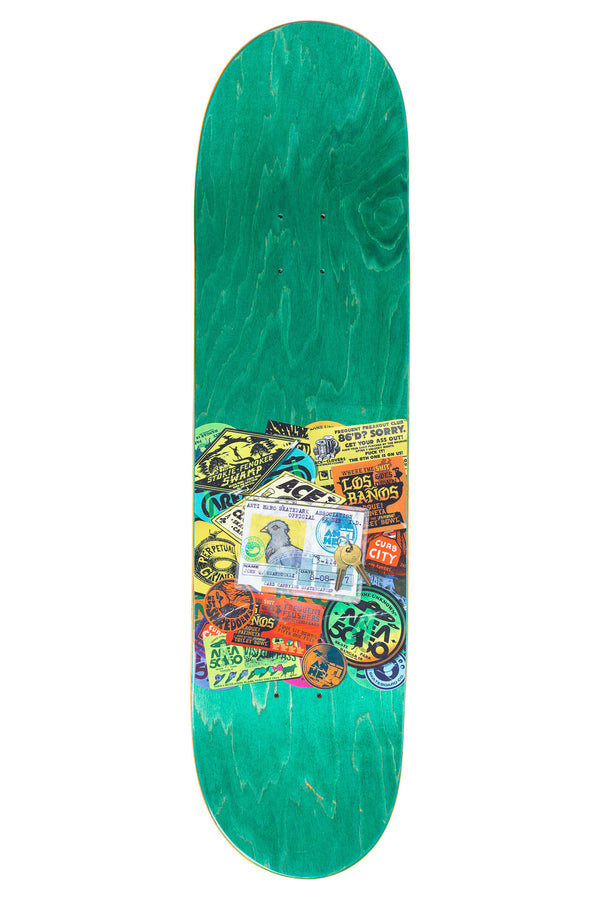 A green skateboard adorned with ANTI HERO RUSSO PARK 8.28 stickers.