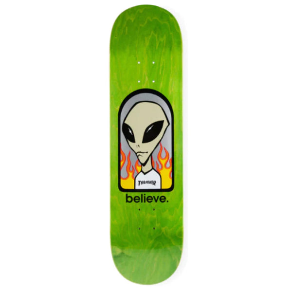 A skateboard with an Alien Workshop X Thrasher Believe Various Stains face on it.