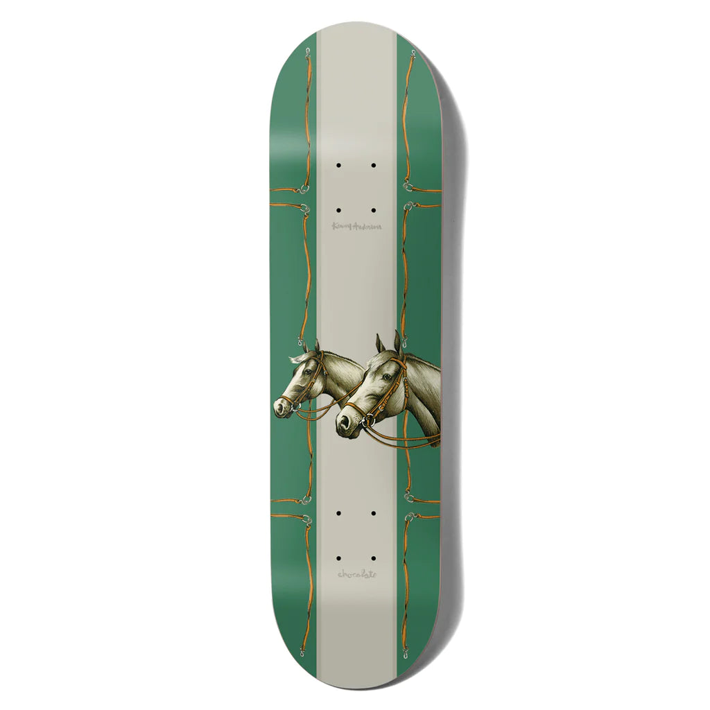 A CHOCOLATE skateboard with two horses on it.