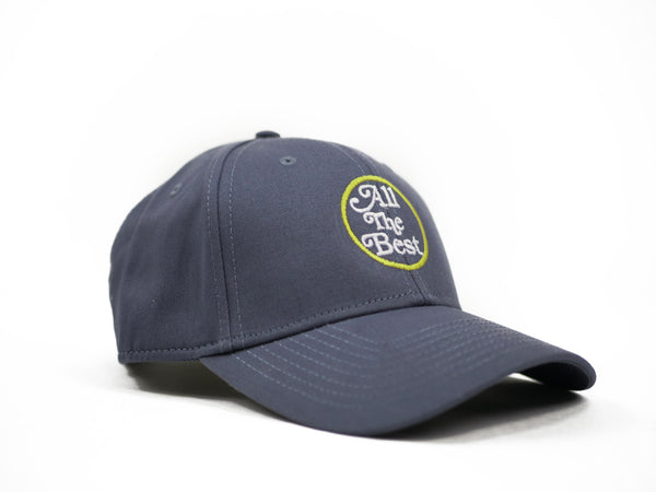 A Bluetile Skateboards hat with a yellow logo on it. The BLUETILE ALL THE BEST SNAP BACK PETRO BLUE hat has a low profile, making it sleek and stylish.