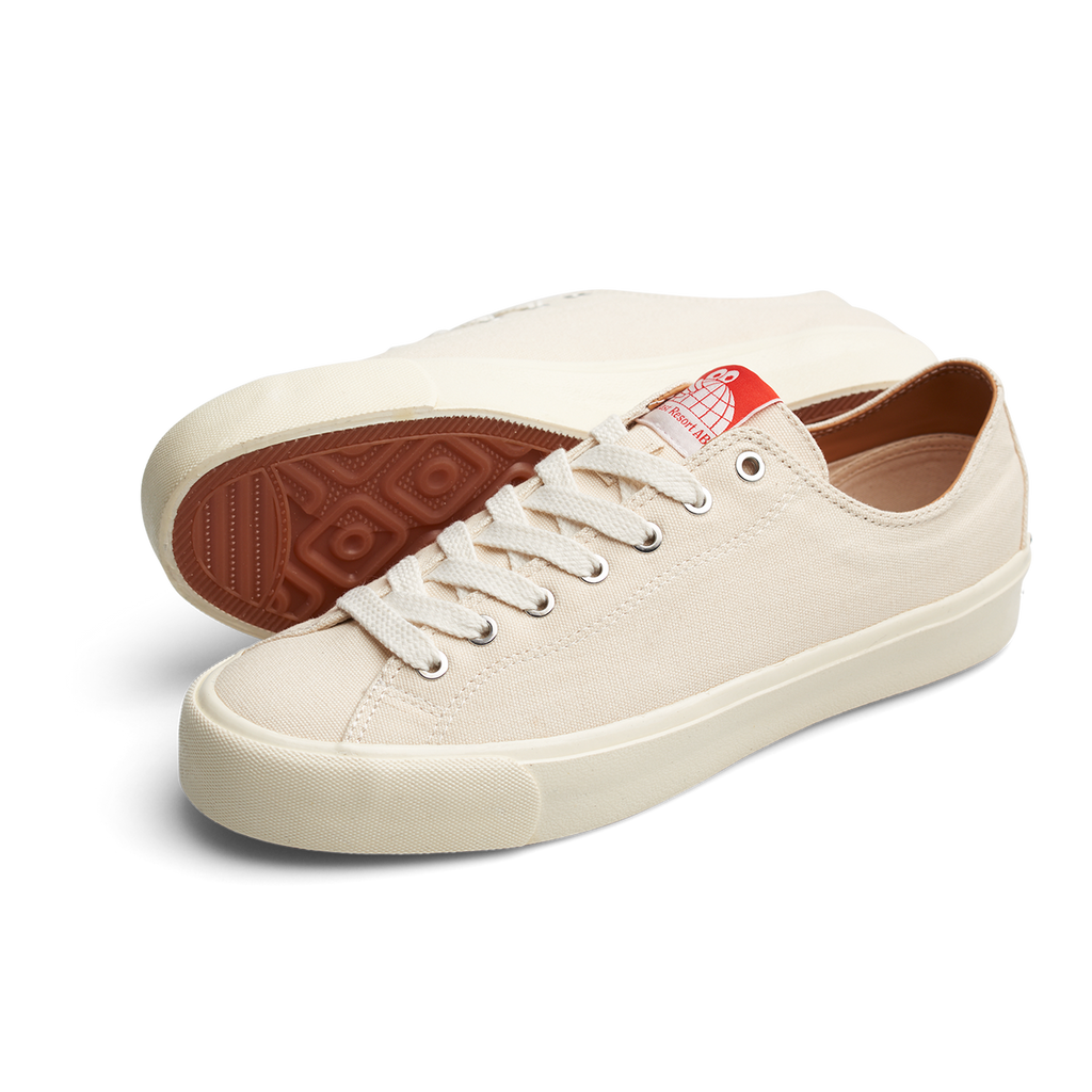 A pair of LAST RESORT AB VM003 CANVAS WHITE/WHITE sneakers with red soles in CANVAS WHITE/WHITE.