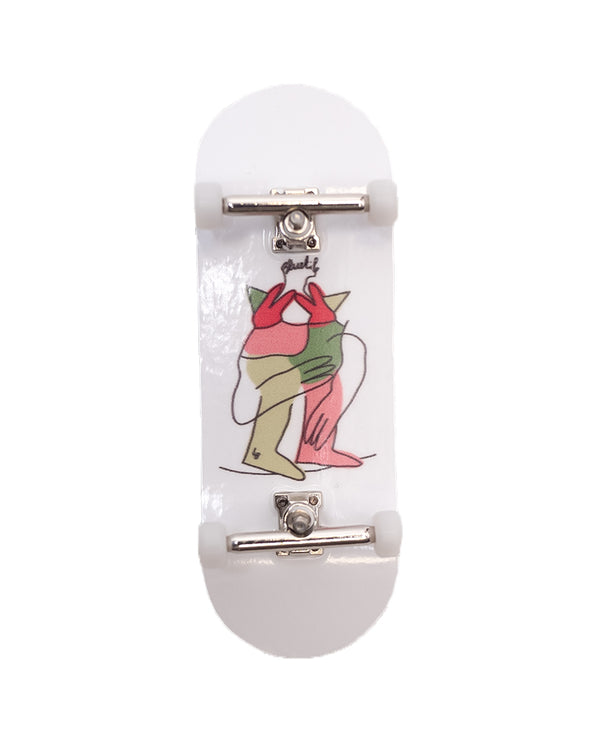 A white skateboard with an image of a woman on it, perfect for skaters who love Bluetile Skateboards' BLUETILE ANNIVERSARY PARTY FINGERBOARD COMPLETE.