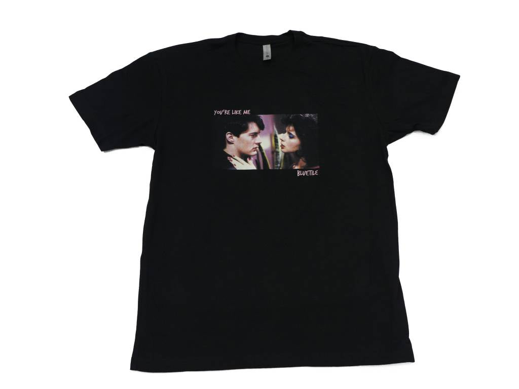 A BLUETILE "LIKE ME" T-SHIRT BLACK with a picture of two people. (Brand: Bluetile Skateboards)