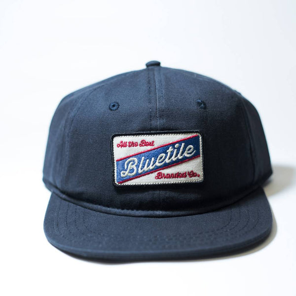 The coolest BLUETILE "ALL THE BEST" COLOR PATCH NAVY hat with a cool patch on it. (Brand: Bluetile Skateboards)