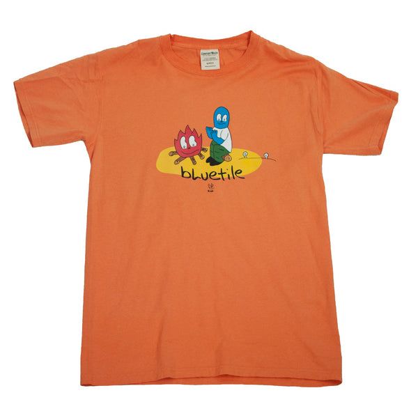 A BLUETILE CAMP FIRE T-SHIRT HORIZON with a cartoon character on it, manufactured by Bluetile Skateboards.