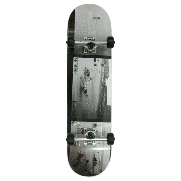 A Bluetile Skateboards skateboard with a black and white photo on it, featuring a stylish black and white design.