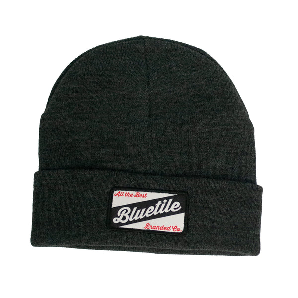 A BLUETILE CRAFT PATCH BEANIE ASPHALT with a Bluetile Skateboards patch.