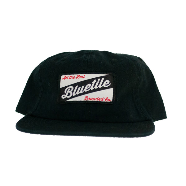 A BLUETILE CRAFT PATCH HAT BLACK with the word blueville PATCH on it.