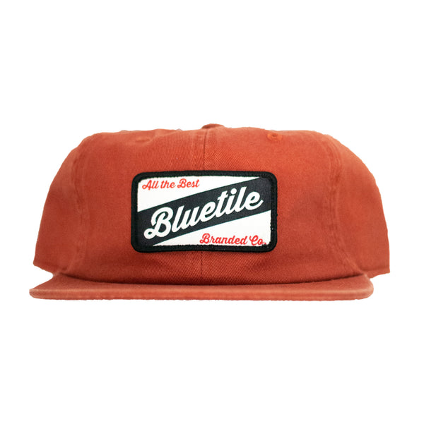 A Bluetile Skateboards BLUETILE CRAFT PATCH HAT COPPER.