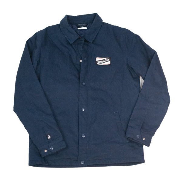 A Bluetile Skateboards Craft Mechanic Jacket with a white logo on it.